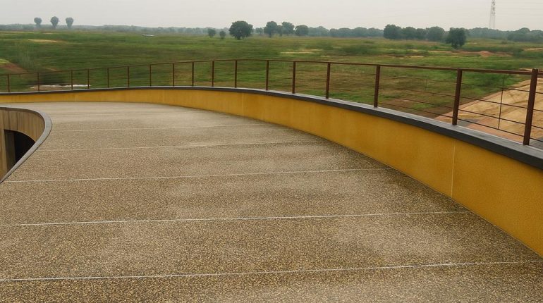 Pebble Stone Flooring applied at Pedestal bridge at Swarnabhoomi at Raipur Chatisgadh – India. A unique floor covering that is Durable, Beautiful, and Long-lasting